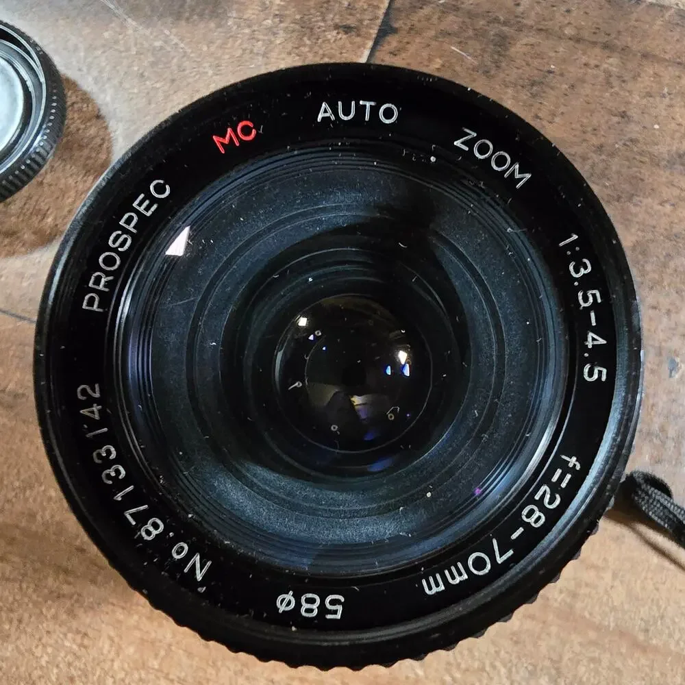 Minolta X370 with a JC Penny f=80 to 200mm zoom lens and prospect f=28-70mm lens